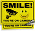 iSYFIX Smile You're on Camera Reflective Stickers for Business - 2 Pack 14x10 Inch - Self-Adhesive Vinyl Decal, Laminated for UV Protection, Fade ...
