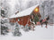 BANBERRY DESIGNS Lighted Christmas Wall Art - LED Red Covered Bridge and Horse Christmas Picture - Fiber Optic Lights in a Canvas Print with a Win...