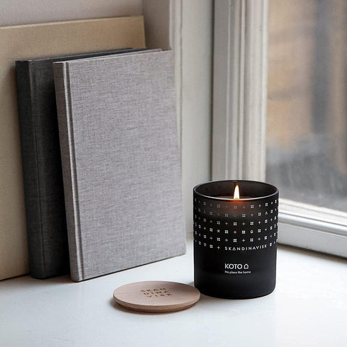 Skandinavisk KOTO 'Home' Mini Scented Candle. Fragrance Notes: Vanilla Beans and Dried Orange Peel, Amber and Leather. 2.3 oz....
