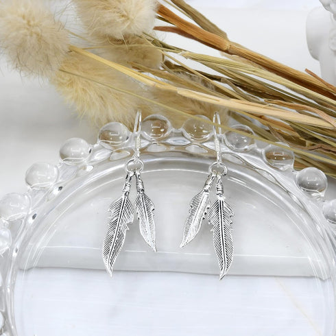 AeraVida Spectacular Double Feather .925 Sterling Silver Dangle Earrings | Luxurious and Elegant Feather Jewelry for a Timeless Look...