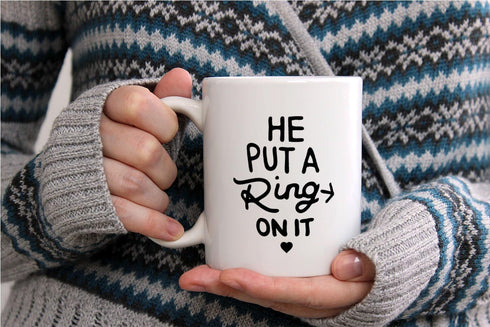 AW Fashions He Put a Ring On It - Funny Engagement Mug - 11OZ Coffee Mug - Mugs For Bride or Fiance - Perfect for Engagement or Wedding (White)...