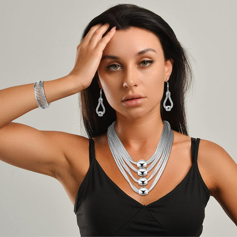 JOERICA 3Pcs Multi-Layer Bib Necklace African Jewelry Set for Women Choker Necklace Stretch Cuff Bracelet Dangle Earrings Halloween Costume Jewelr...