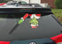 Grim Santa Waving Winter WiperTag with Decal attaches to rear vehicle wiper blade...