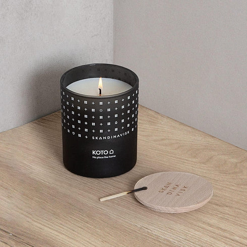Skandinavisk KOTO 'Home' Mini Scented Candle. Fragrance Notes: Vanilla Beans and Dried Orange Peel, Amber and Leather. 2.3 oz....