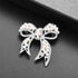 Nicole Miller Silver White Round Pearls Ribbon Clear Rhinestones Brooches and Pins...