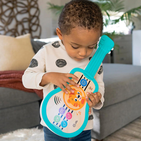 Baby Einstein Sing & Strum Magic Touch Ukulele Wooden Musical Toy, Ages 6 Months+, Multicolored...