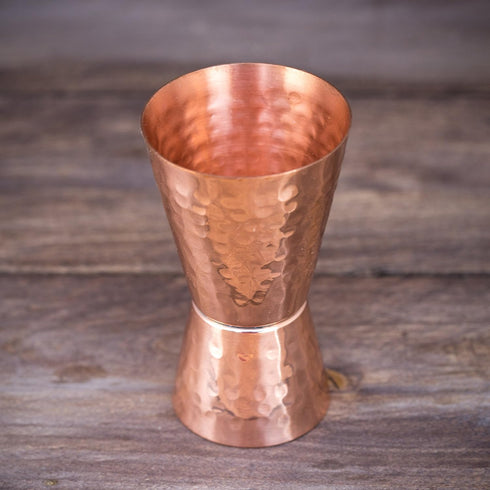 Copper jigger lacquered for the shine and to prevent tarnish. - Double 1oz/2oz copper measuring jigger for cocktail mixing. - Solid hammered coppe...