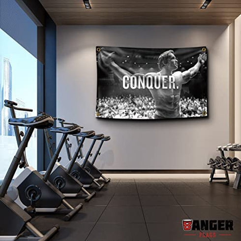 Banger Flags Banger - Original Arnold Schwarzenegger Conquer Motivational Inspirational Office Gym Wall Decor Design on a 3X5 Feet Flag with 4 Grommets for Easy Hanging. Authentic