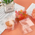Jutieuo 100 Pack Clear Boxes for Favors 2x2x2 Inches with White Silk Ribbon, Transparent Cube Candy Boxes for Wedding Baby Shower Birthday Party Favor Boxes, Individual Macaron Display Packaging Box
