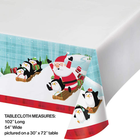 Fun with Santa Themed Party Supplies | Bundle Includes Paper Plates and Napkins for 16 People Plus Tablecover | Santa and Penguins Design