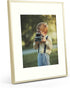 Frametory, 11x14 Metal Picture Frame - Aluminum Thin Molding - Photo Frame with Ivory Color Mat for 8x10 Wall Art & Pre-Installed Mounting Hardware - Real Glass (Gold, 1 Pack)