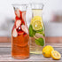Estilo Glass Carafe Pitcher - Cocktail Beverage & Water Carafe With Lids - Narrow Neck Design, 1 Liter (33oz) Set of 2, Clear