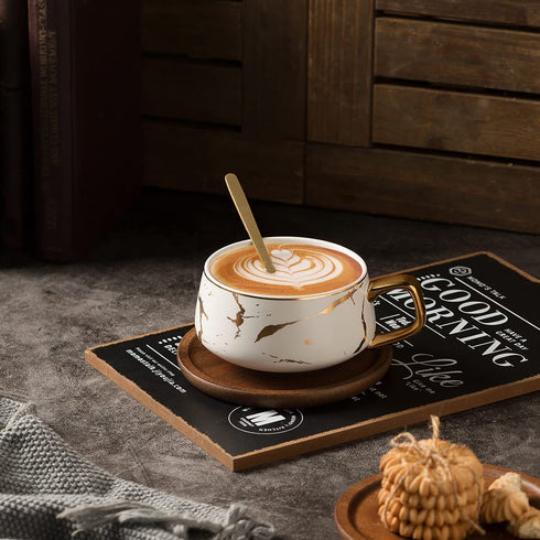 TILANY Tea Cup and Wooden Saucer Set - Luxury 10 Oz Ceramic Latte Mug with Golden Spoon & Coffee Saucer Fancy Gold Planted Handle Coffee Cups Modern Teacup Set for Women, Men (White)