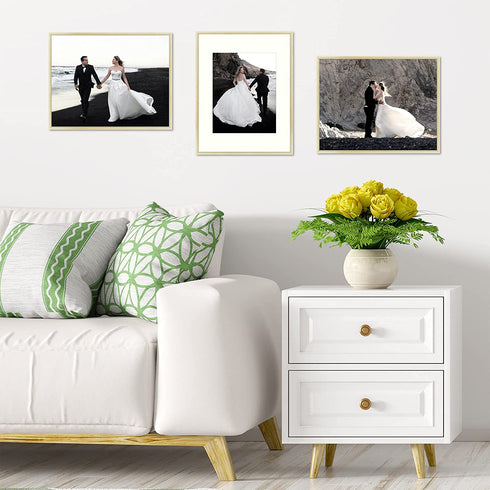 Frametory, 11x14 Metal Picture Frame - Aluminum Thin Molding - Photo Frame with Ivory Color Mat for 8x10 Wall Art & Pre-Installed Mounting Hardware - Real Glass (Gold, 1 Pack)
