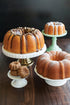 Nordic Ware 12-Cavity Mini Bundt Cupcake Pan, Colors Vary