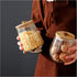 Small Glass Coffee Nuts Canister Airtight Storage Jar Petal Decorative Container with Bamboo Lid Metal Handle Easy to Grasp 700ml, 23 FL OZ (Set of 2)