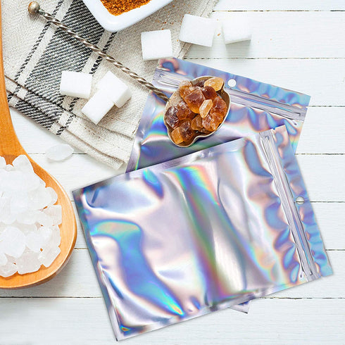 100 Counts Resealable Smell Water Proof Bags Foil Pouch Bag Flat Ziplock Bag with Clear Window for Party Favor Food Storage Gifts Bags Goodie Bag Holographic Color, 5.5 x 7.8 Inches