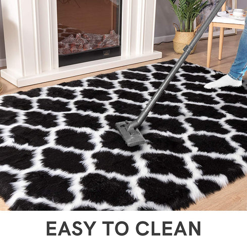 Carvapet Moroccan Shaggy Soft Faux Sheepskin Fur Area Rugs Floor Mat Luxury Beside Carpet for Bedroom Living Room 2ft x 4ft, White Strips on Black