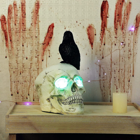 DR.DUDU Raven on Skull Halloween Decoration with LED Lights, Gothic Crow Perching on Skeleton Resin Figurine Haunted House Statue for Tabletop Desk Home Office Decor